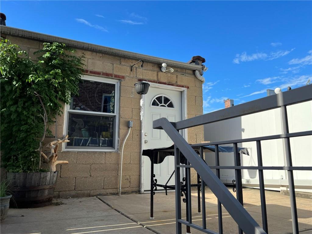 83 Gravesend Neck Road Brooklyn, NY 11223 - Photo 9 of 27 a front view of a house with stairs