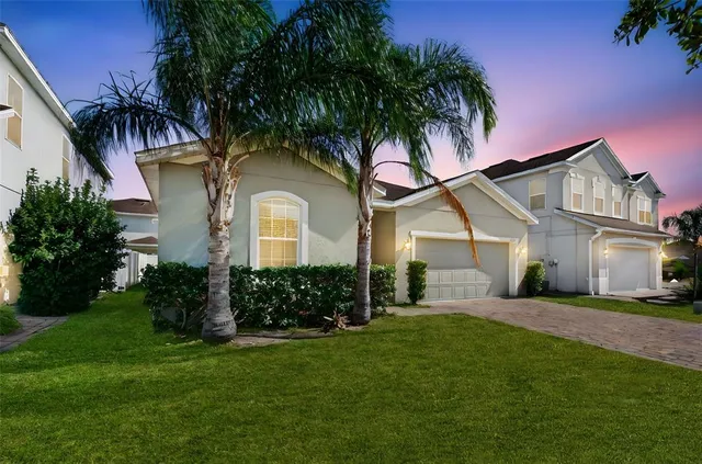 front view of a house with a yard