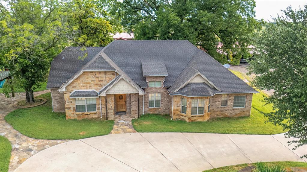 777 Stiles Road, Unit 789 Whitesboro, TX 76273 - Photo 5 of 37 front view of a house with a yard