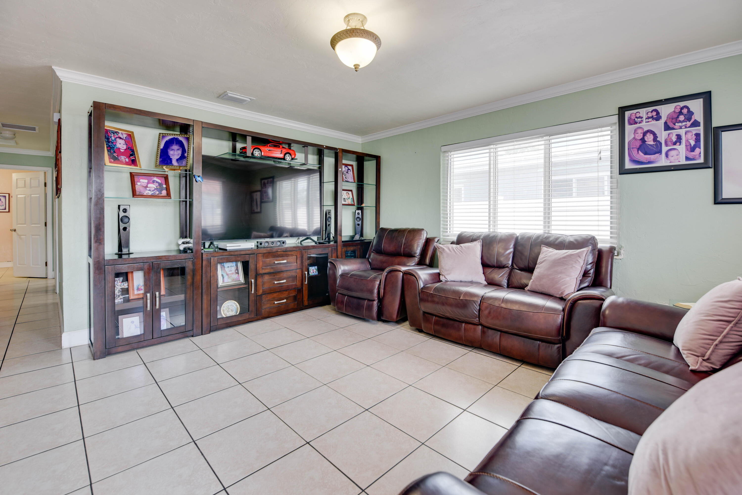 1524 5th Street Key West, FL 33040 - Photo 5 of 31 a living room with furniture and a flat screen tv
