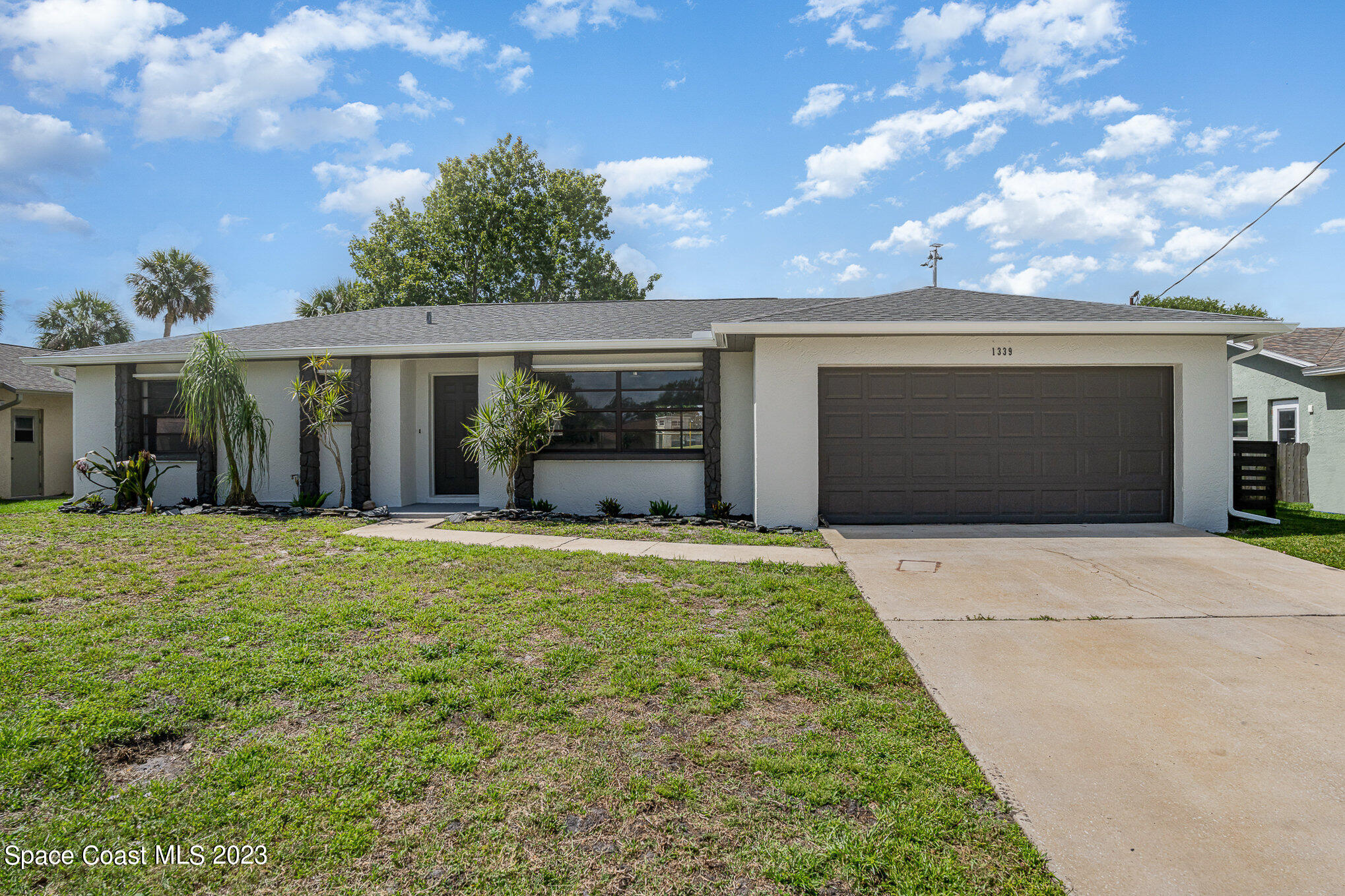 a front view of a house with garden