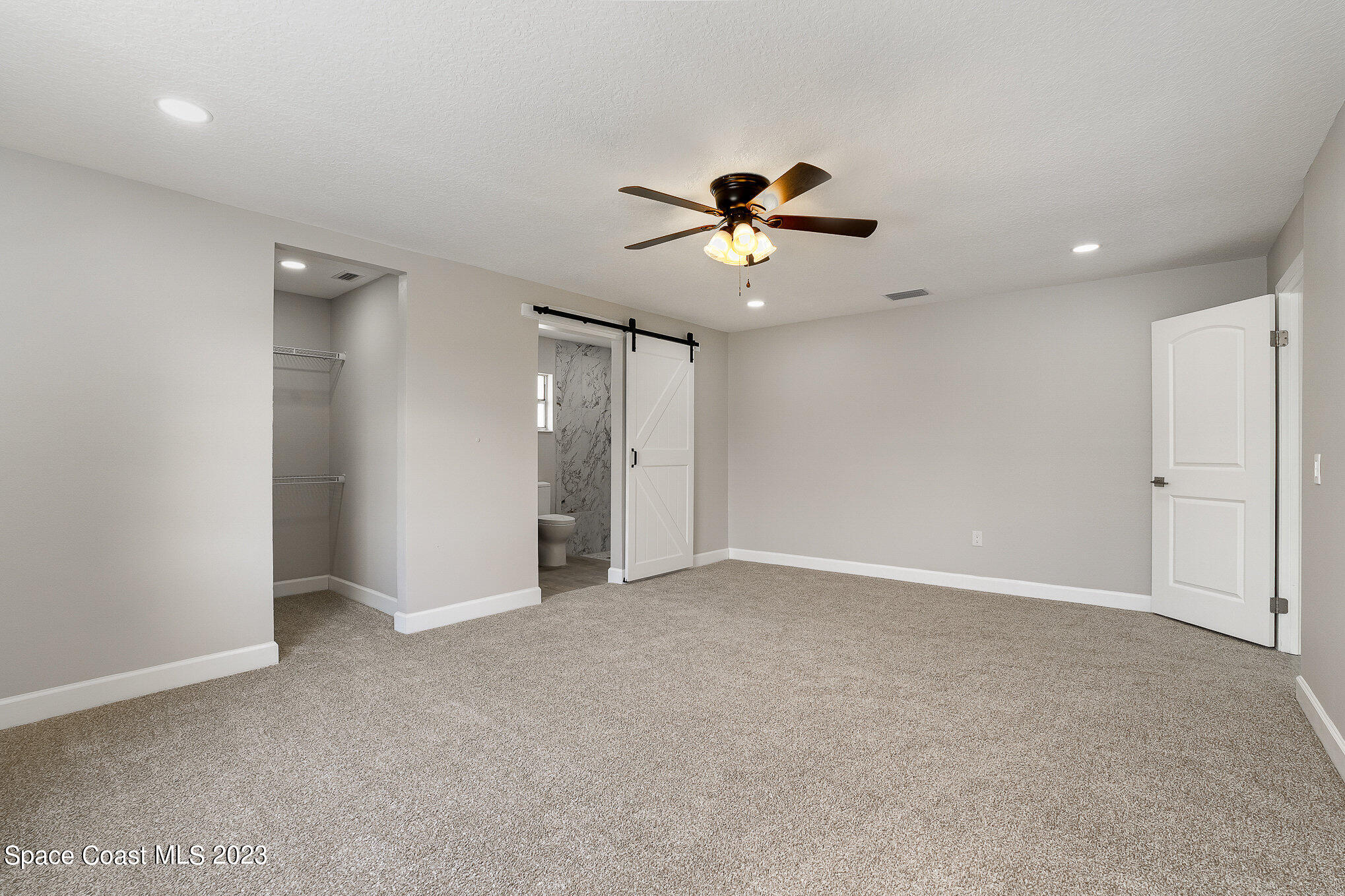 1339 Forest Drive Rockledge, FL 32955 - Photo 12 of 21 a view of an empty room with a ceiling fan