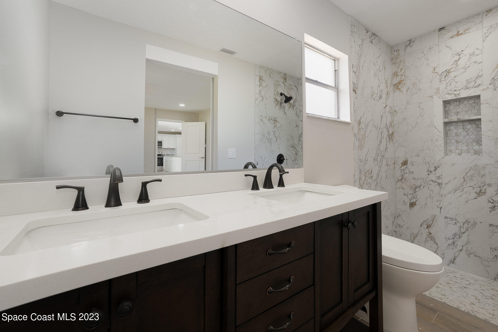 1339 Forest Drive Rockledge, FL 32955 - Photo 13 of 21 a bathroom with a sink and a toilet