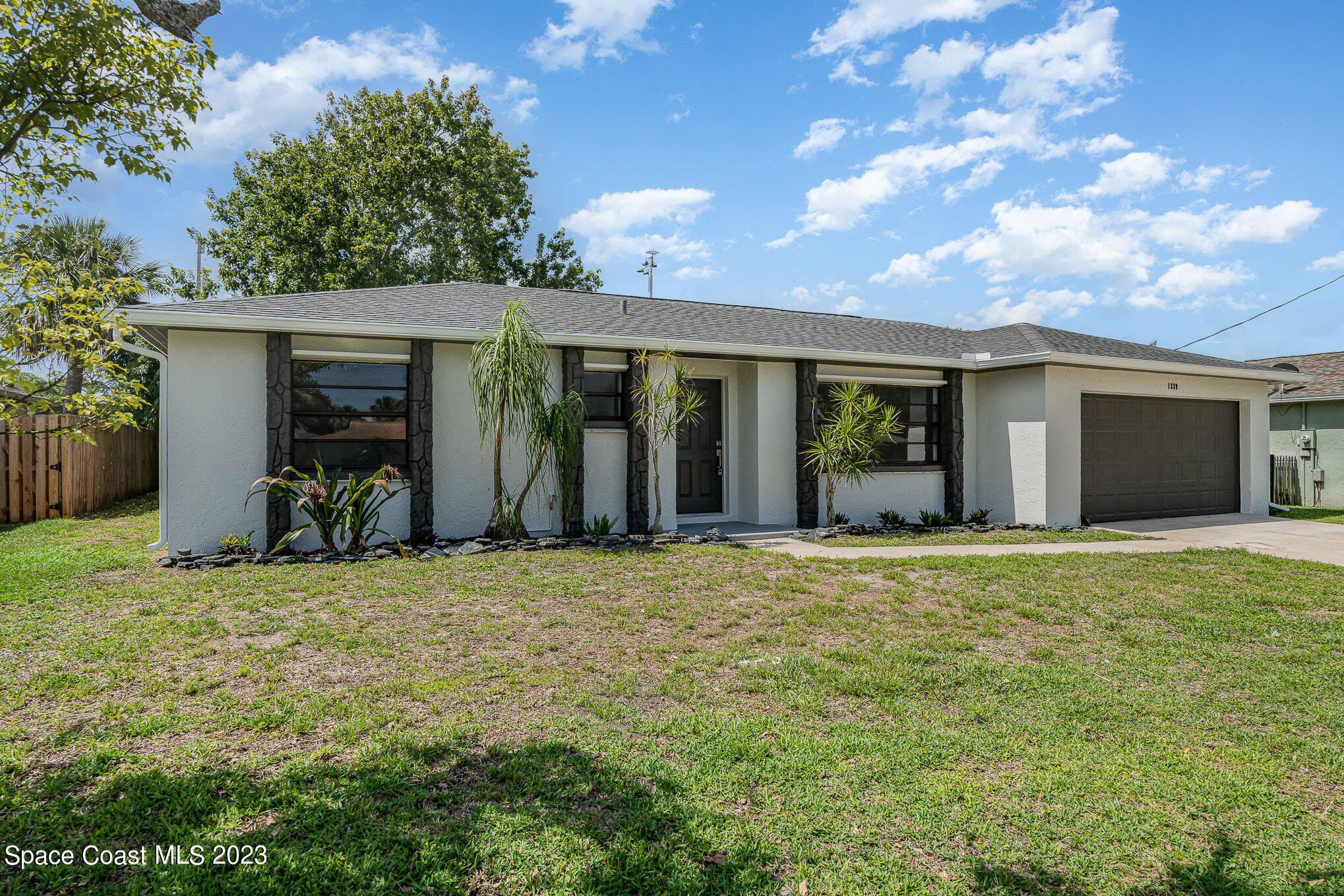 1339 Forest Drive Rockledge, FL 32955 - Photo 14 of 21 a view of a house with backyard and porch