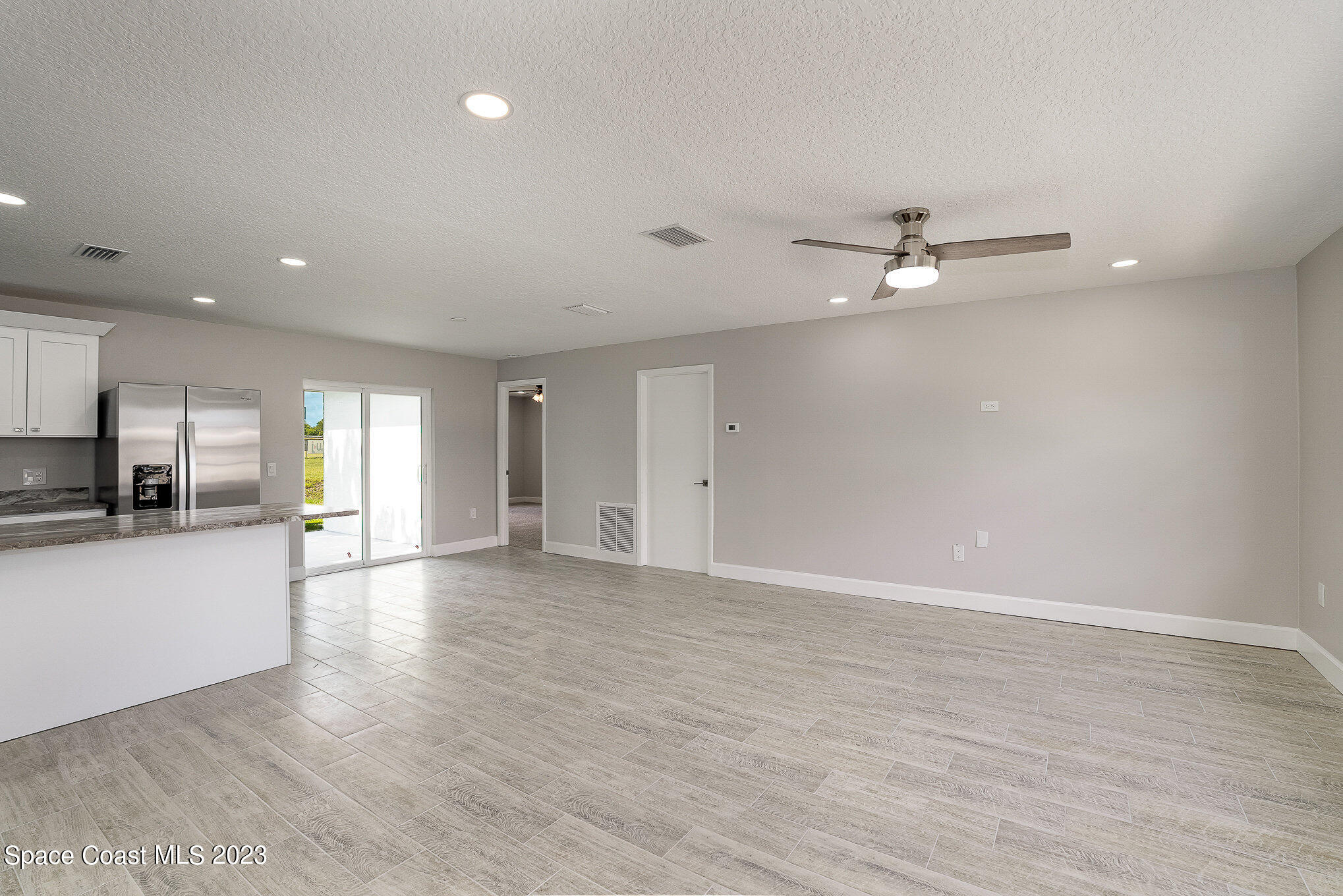 1339 Forest Drive Rockledge, FL 32955 - Photo 6 of 21 a view of a livingroom with a kitchen counter top and appliances