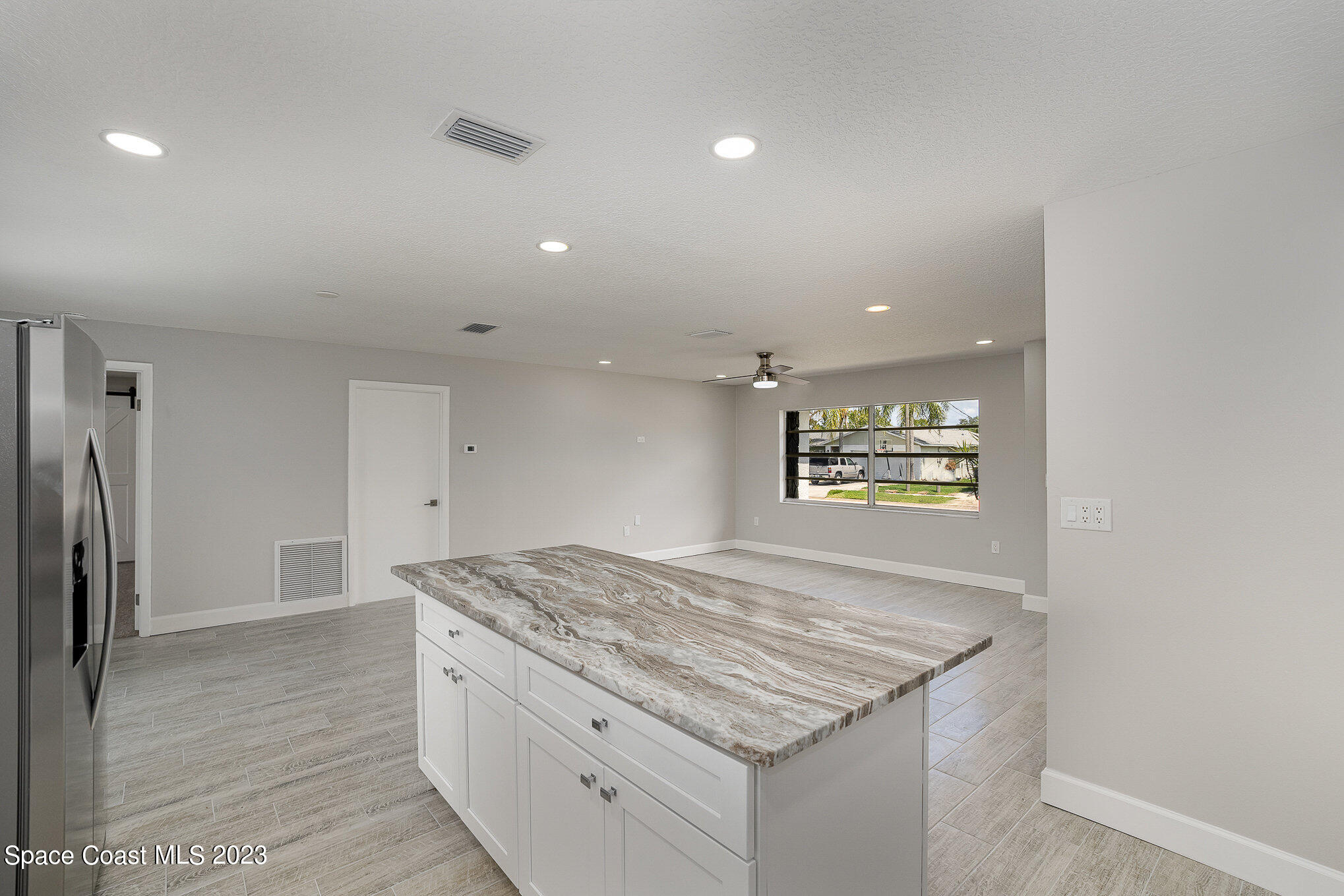 1339 Forest Drive Rockledge, FL 32955 - Photo 8 of 21 a kitchen with stainless steel appliances granite countertop a sink stove and refrigerator