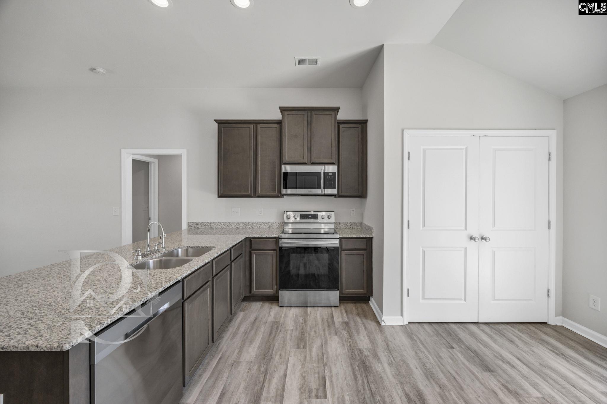 235 Drayton Hall Road West Columbia, SC 29172 - Photo 8 of 24 a kitchen with granite countertop a sink stove and refrigerator