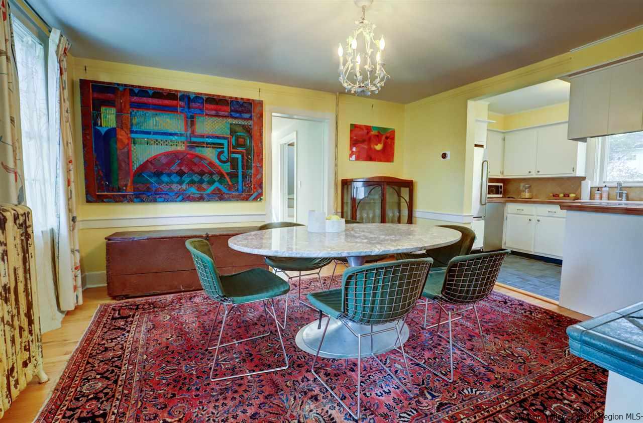 3572 Main Street Stone Ridge, NY 12484 - Photo 16 of 35 a view of a dining room with furniture a rug and wooden floor