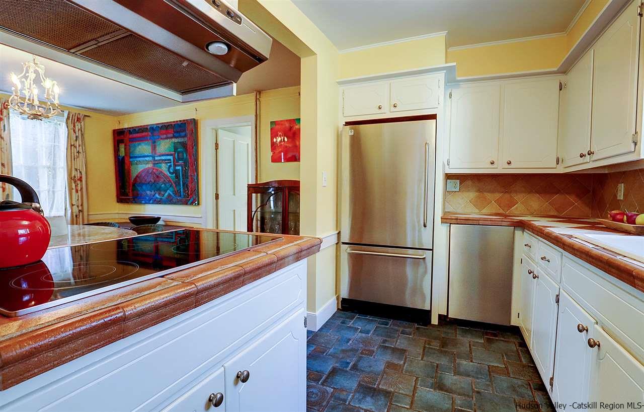 3572 Main Street Stone Ridge, NY 12484 - Photo 19 of 35 a kitchen with stainless steel appliances a refrigerator sink and cabinets