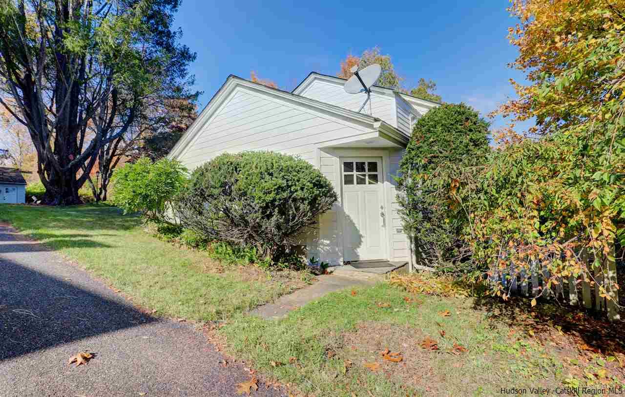 3572 Main Street Stone Ridge, NY 12484 - Photo 25 of 35 a front view of a house with a yard