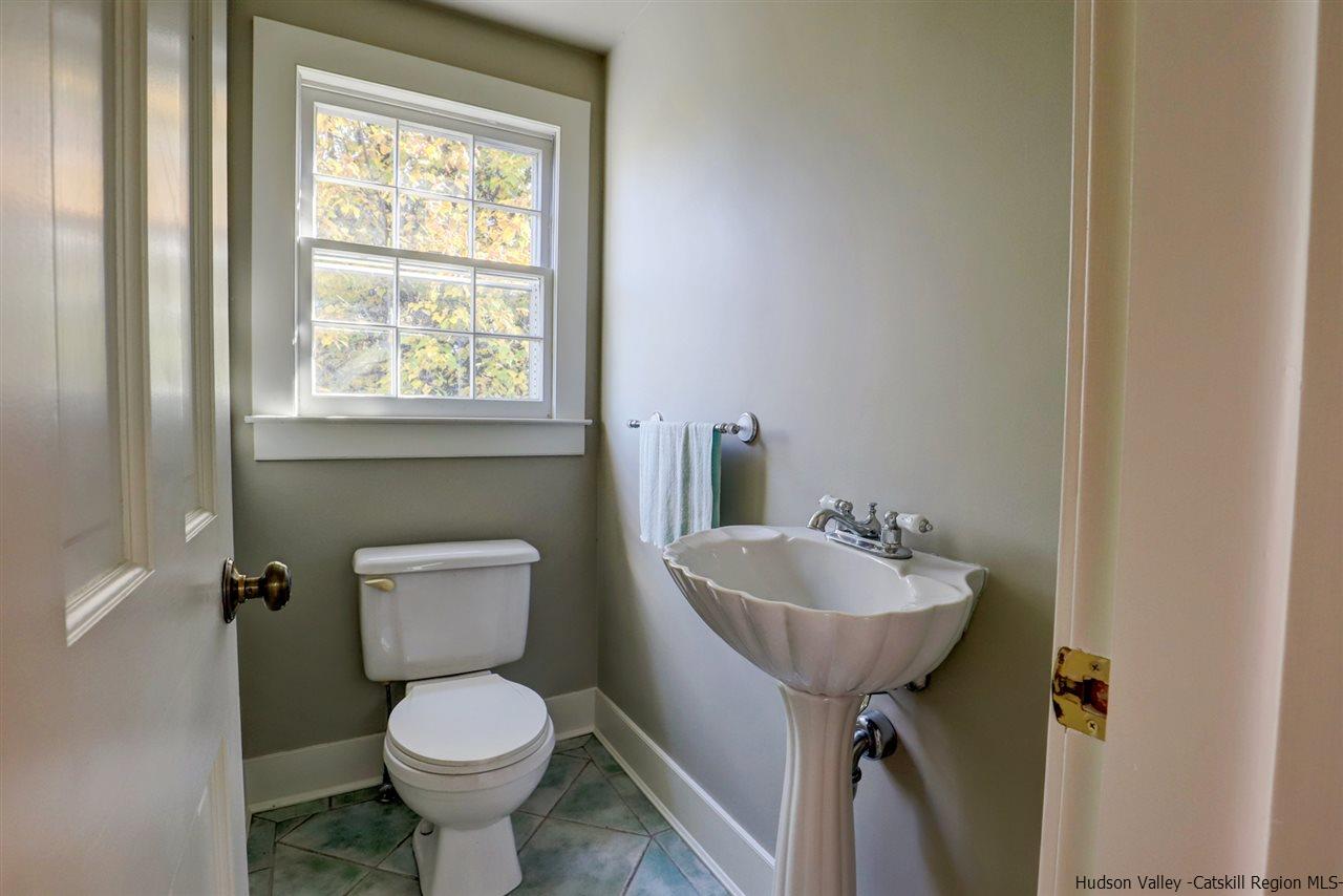 3572 Main Street Stone Ridge, NY 12484 - Photo 29 of 35 a bathroom with a toilet sink and mirror