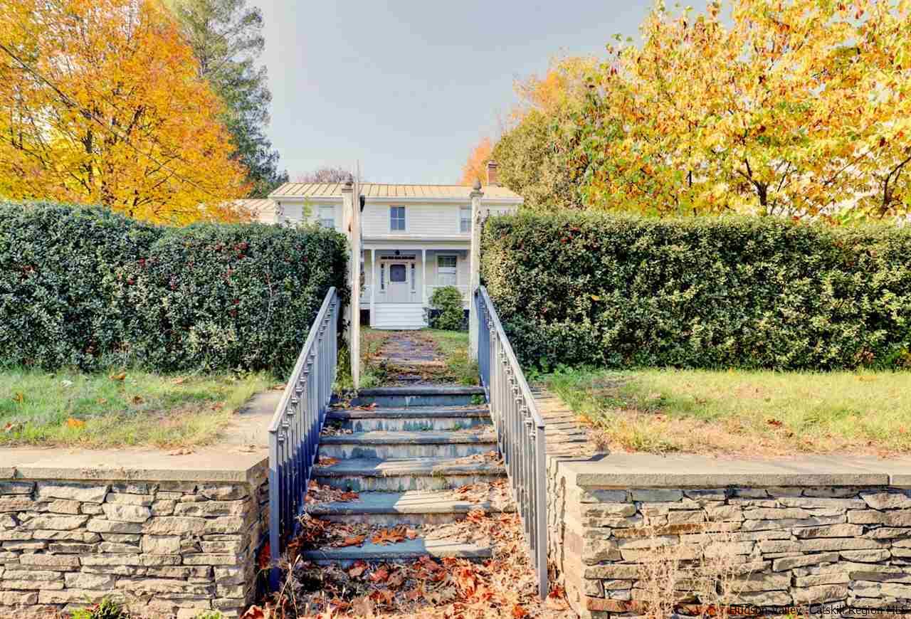 3572 Main Street Stone Ridge, NY 12484 - Photo 33 of 35 a view of a yard with plants and wooden fence