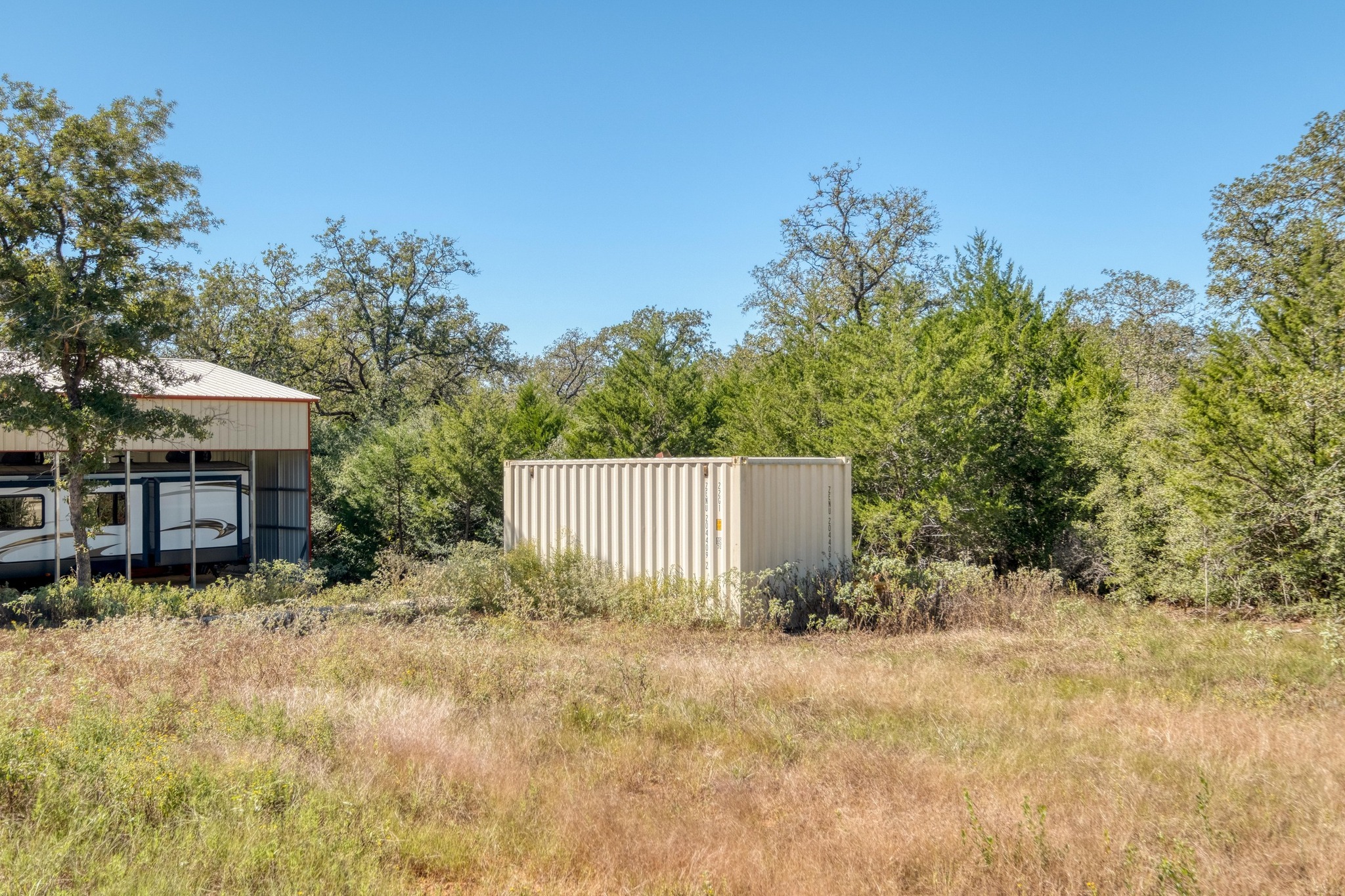 532 Peach Creek Road Rosanky, TX 78953 - Photo 12 of 17 a backyard of a house with table and chairs