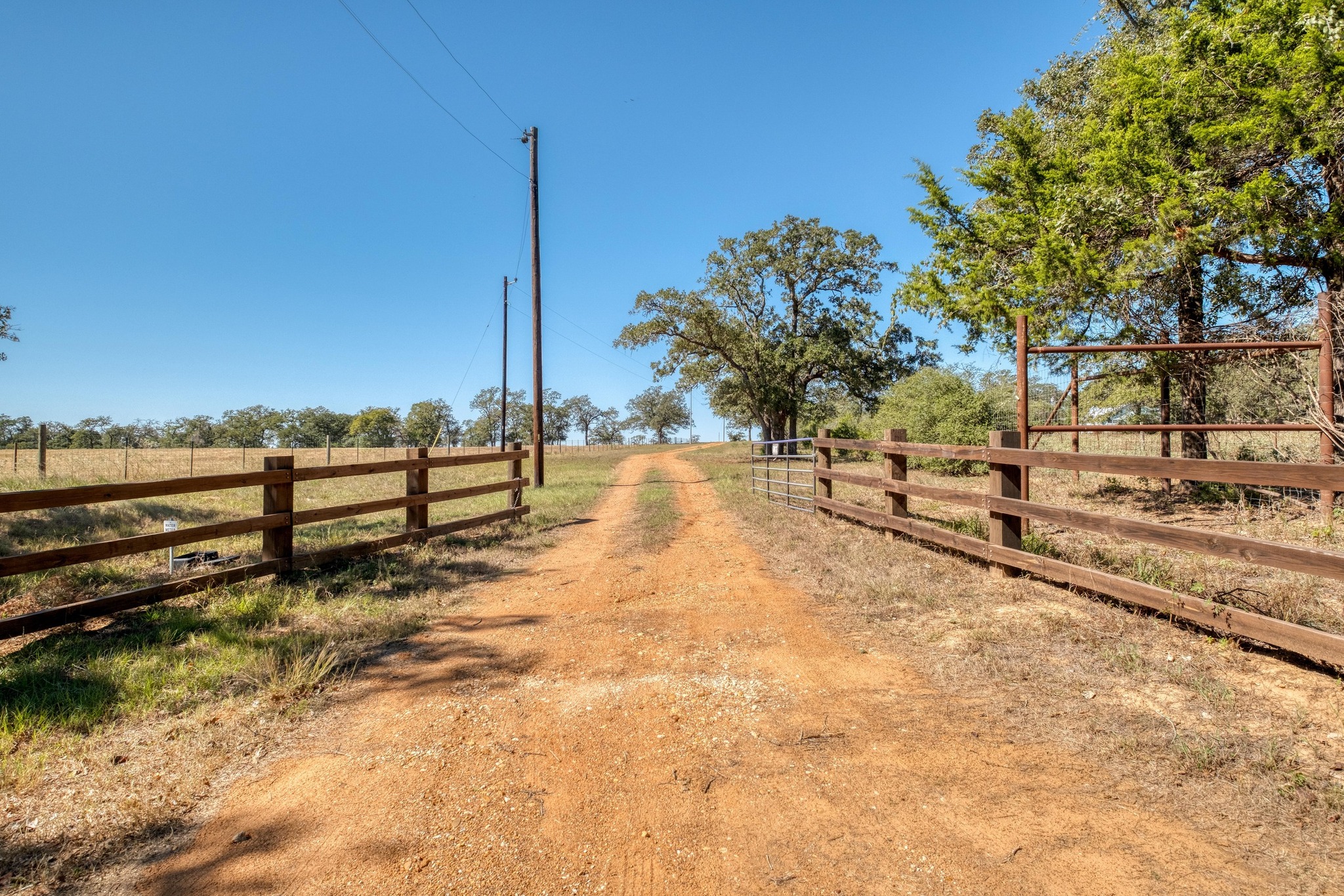 532 Peach Creek Road Rosanky, TX 78953 - Photo 7 of 17 a view of a yard with wooden fence