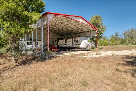 a view of a garage with cars