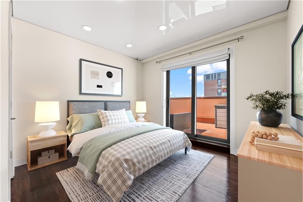 3165 Emmons Avenue, Unit PH3N Brooklyn, NY 11235 - Photo 15 of 33 a bedroom with a large bed and a window