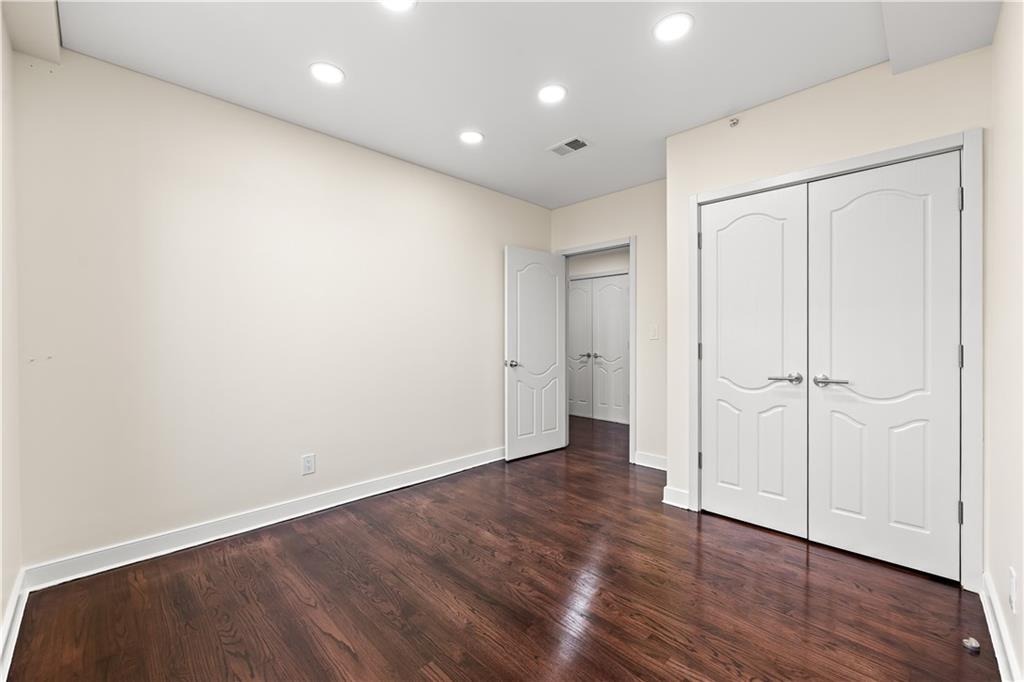3165 Emmons Avenue, Unit PH3N Brooklyn, NY 11235 - Photo 16 of 33 a view of an empty room with wooden floor