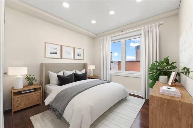 a bedroom with a large bed and a couch