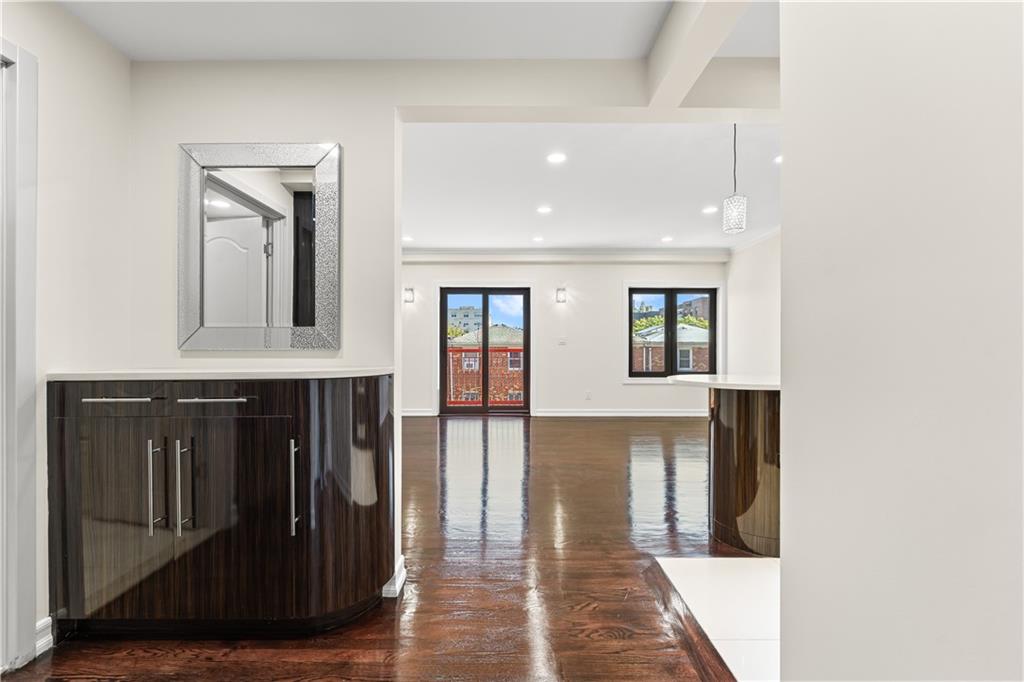 3165 Emmons Avenue, Unit PH3N Brooklyn, NY 11235 - Photo 2 of 33 a view of a hallway with wooden floor and cabinet