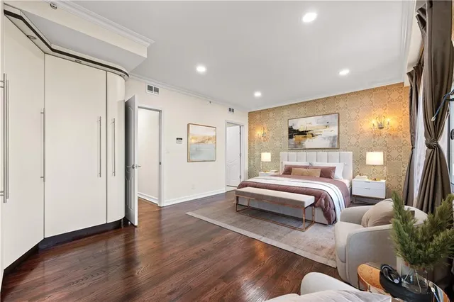 a bedroom with furniture and a window