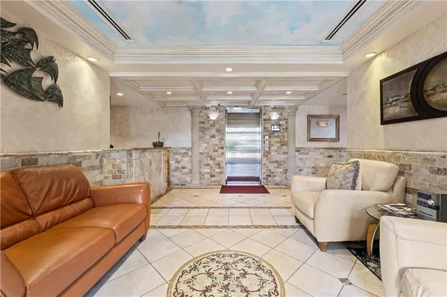 a living room with furniture and a painting