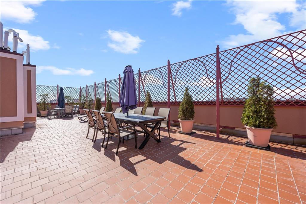 3165 Emmons Avenue, Unit PH3N Brooklyn, NY 11235 - Photo 28 of 33 a view of a patio with a table and chairs