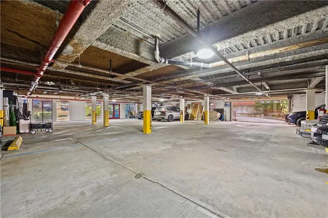 a view of parking garage with red