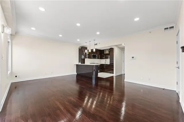 a view of a kitchen with dining space and wooden floor