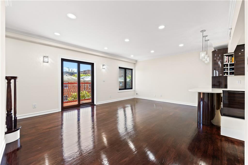 3165 Emmons Avenue, Unit PH3N Brooklyn, NY 11235 - Photo 5 of 33 a view of empty room with wooden floor and fan