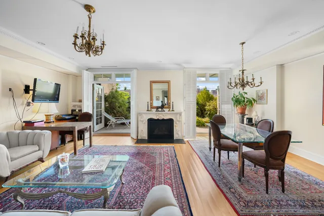 a bedroom with a bed and a fireplace