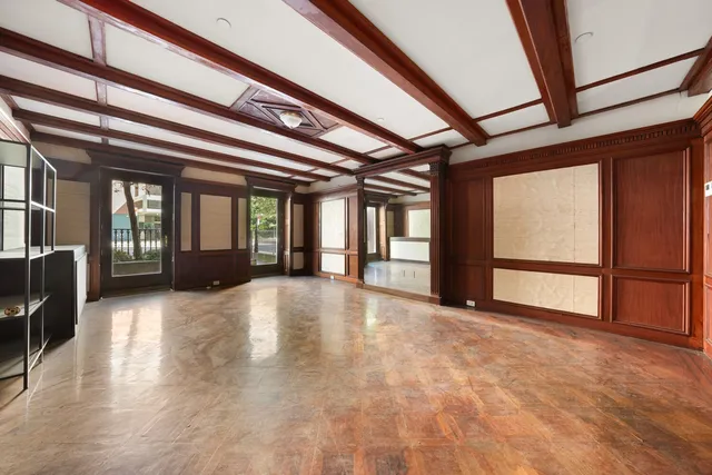 a view of a chairs and table in the back yard of the house