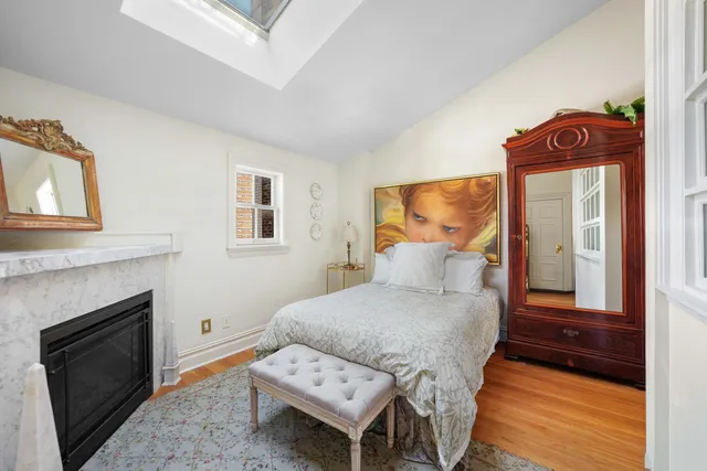 a kitchen with a stove a sink a dining table and chairs