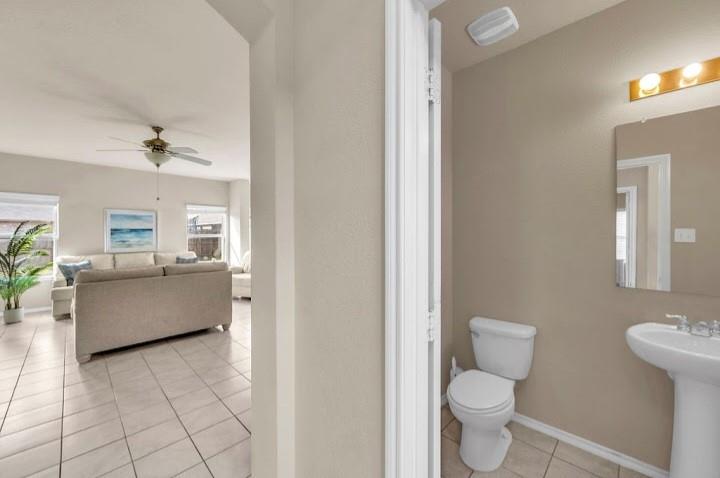 2315 Julia Lane Forney, TX 75126 - Photo 14 of 35 Half bathroom with light tile patterned flooring and ceiling fan