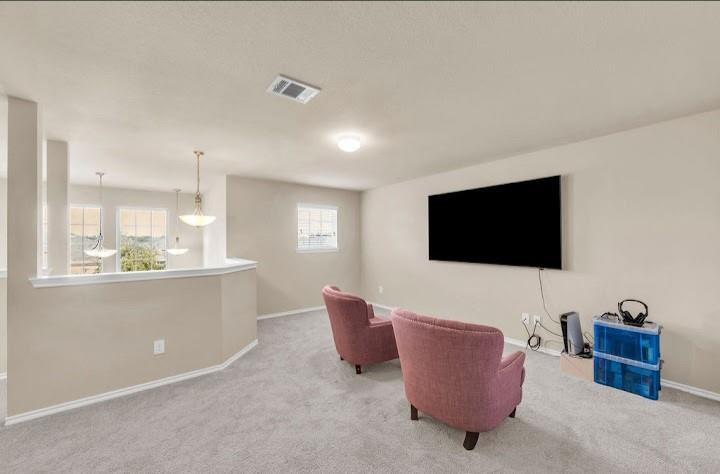 2315 Julia Lane Forney, TX 75126 - Photo 19 of 35 Living room featuring carpet floors and baseboards
