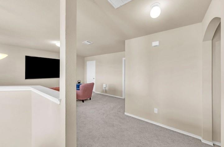 2315 Julia Lane Forney, TX 75126 - Photo 22 of 35 Hallway featuring carpet flooring and arched walkways