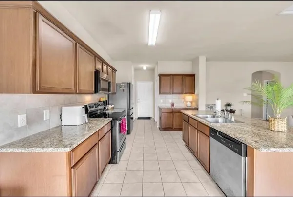 a kitchen with granite countertop lots of counter top space
