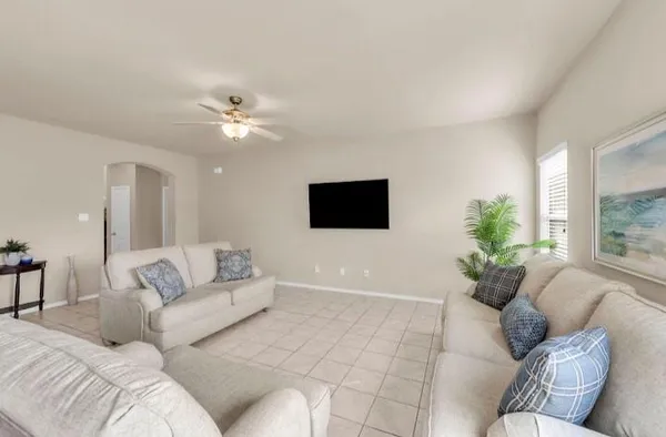 a living room with furniture and a flat screen tv