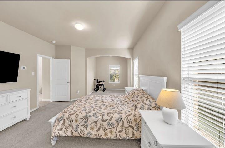 2315 Julia Lane Forney, TX 75126 - Photo 29 of 35 Bedroom with light carpet and baseboards