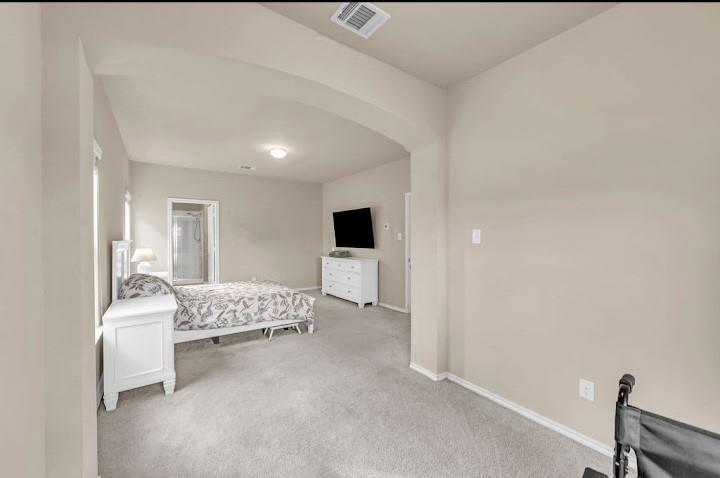 2315 Julia Lane Forney, TX 75126 - Photo 32 of 35 Bedroom with carpet flooring and arched walkways