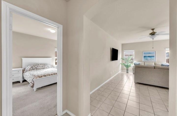 2315 Julia Lane Forney, TX 75126 - Photo 33 of 35 Hall with light colored carpet and light tile patterned floors