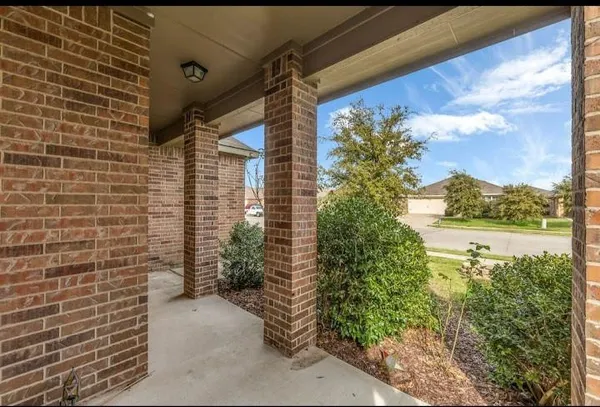 a view of a pathway both side of house