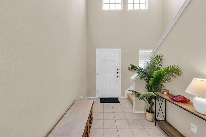 2315 Julia Lane Forney, TX 75126 - Photo 9 of 35 Foyer with light tile patterned floors and a high ceiling