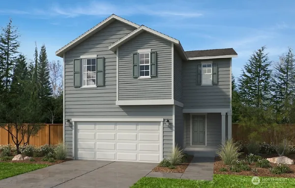 a front view of a house with a garage