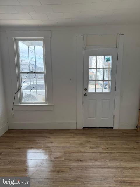 103 North Maple Street Mount Carmel, PA 17851 - Photo 3 of 11 an empty room with wooden floor and windows