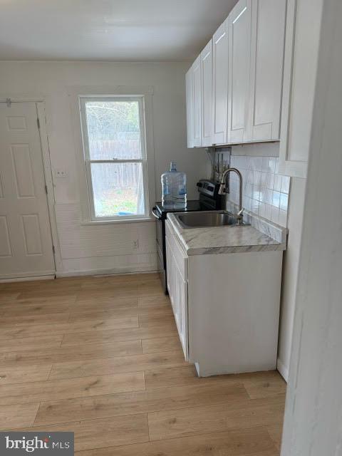 103 North Maple Street Mount Carmel, PA 17851 - Photo 6 of 11 a kitchen with stainless steel appliances granite countertop a sink stove and cabinets