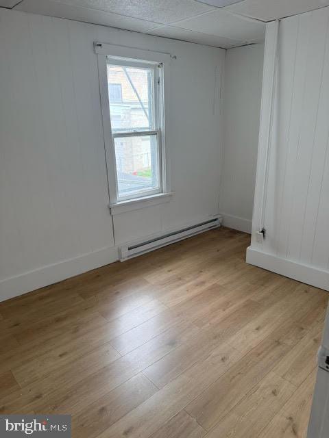 103 North Maple Street Mount Carmel, PA 17851 - Photo 9 of 11 an empty room with wooden floor and windows