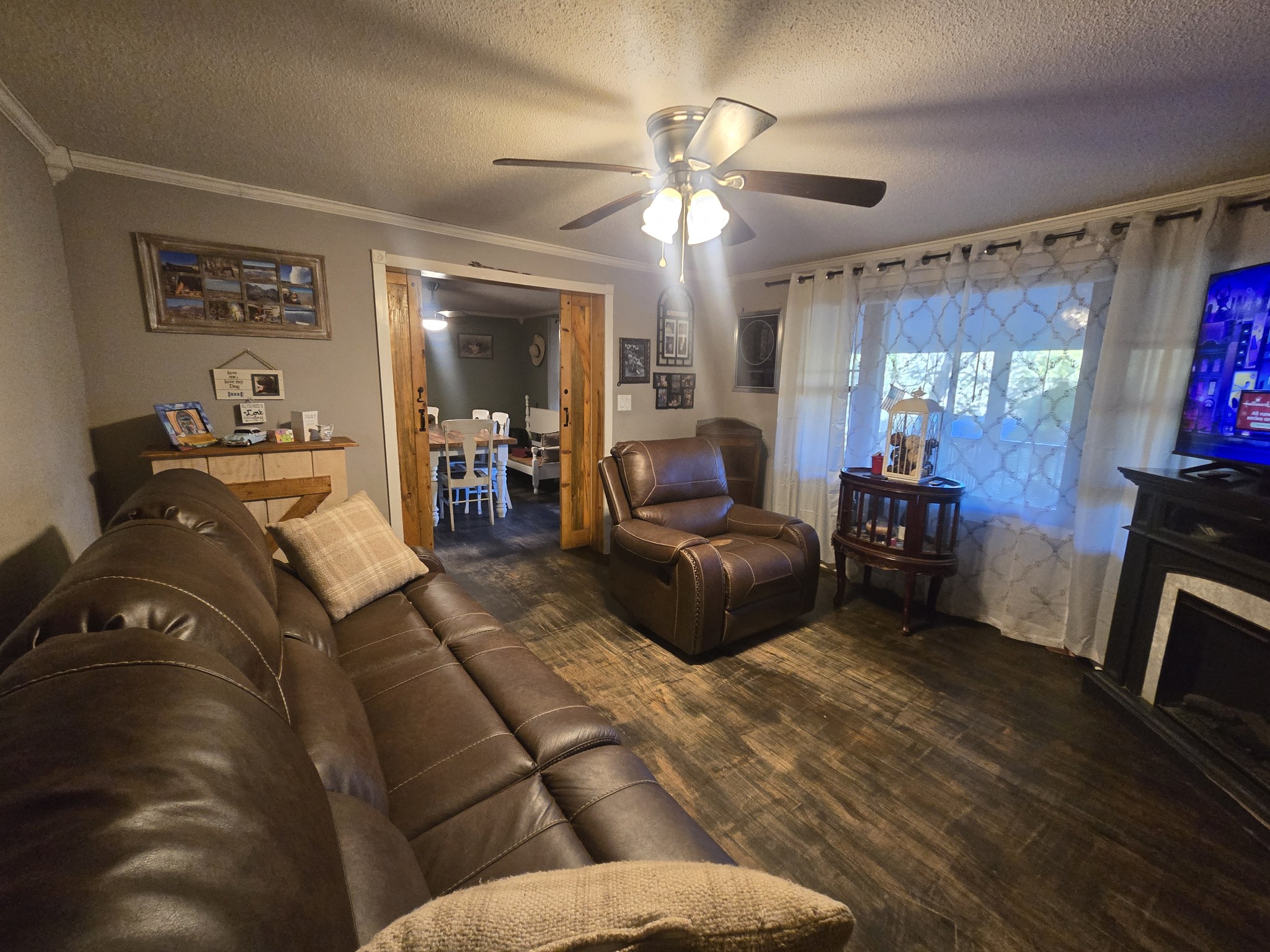75 Travis Street Tracy City, TN 37387 - Photo 19 of 37 a living room with furniture and a flat screen tv