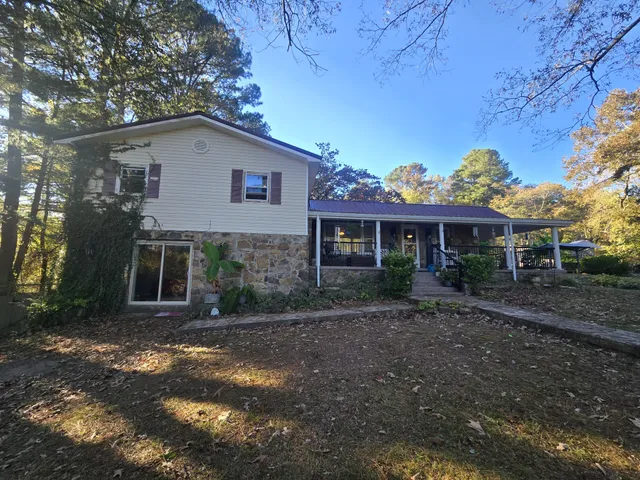a view of a porch with chairs and backyard