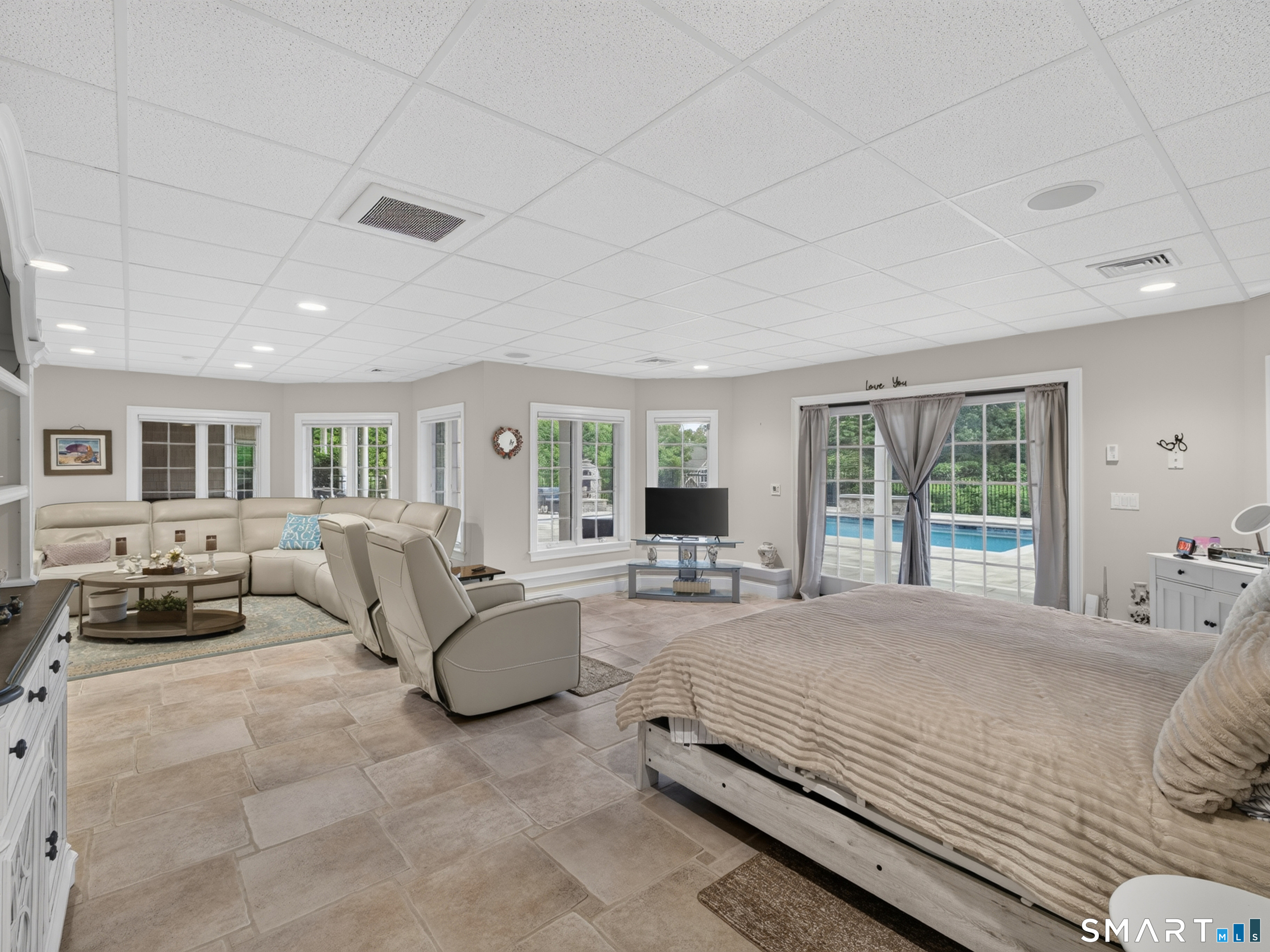 55 Hunters Ridge Rocky Hill, CT 06067 - Photo 32 of 40 a bedroom with a large bed and a couch