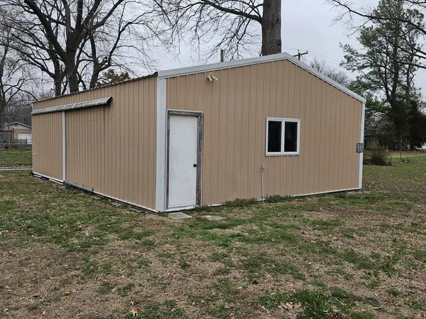 a house view with a backyard space